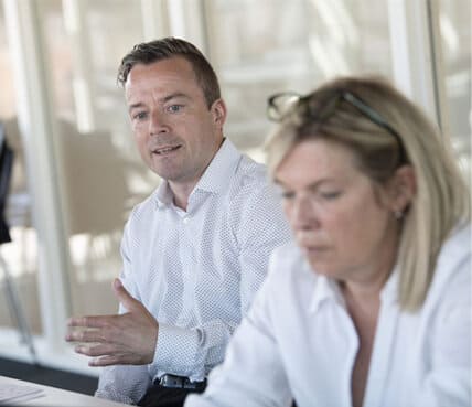 Klaus Larsen and Pernille Kræmmergaard discussing DI2X Partnership
